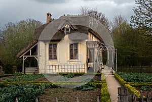 Old farm with thatched roof from the beautiful estate of Trianon, Queen\'s Hamlet