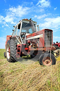 Old Farm Tractor in Grass Field
