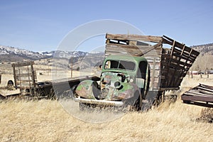 Old farm truck in a field of junk