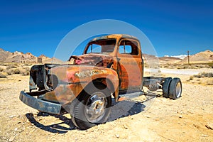 Old farm truck left in ghost town in the desert