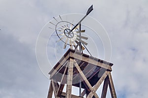 Old farm windmill with metal blades