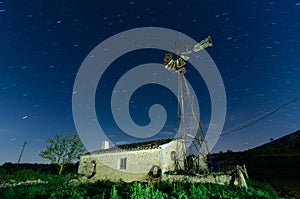 Old Farm Windmill for Pumping Water with Spinning Blades