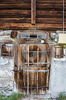 Old farm wooden door in the swiss alps