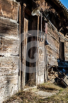 Old farm and wooden house, window, door in an old country house.