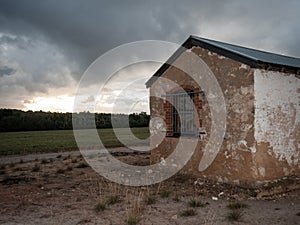 Old farmhouse building at dusk