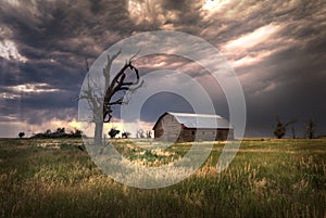 Old Farmhouse at Sunset On a Meadow