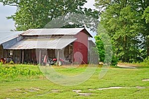 Old Farming Equipment, Tractor, and Red Barn