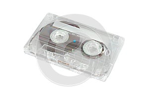 Old-fashiened compact audio cassette of transparent plastic