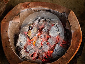 Old fashion firepot with coal