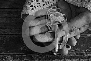 Old fashion lady holds a golden key in her hands