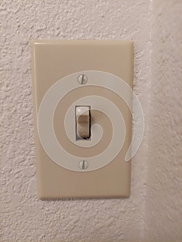 Old fashion light switch on a white wall