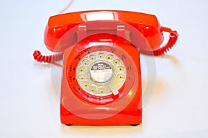 Old fashion rotary dial phone on white background