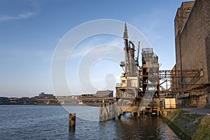 Old fashion rusty Port grain elevator. Industrial sea trading port bulk cargo zone in Rotterdam harbour