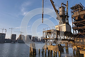 Old fashion rusty Port grain elevator. Industrial sea trading port bulk cargo zone in Rotterdam harbour