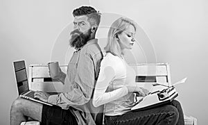 Old fashioned against modern, outdated against new. Man work use modern stylish laptop and woman work retro typewriter