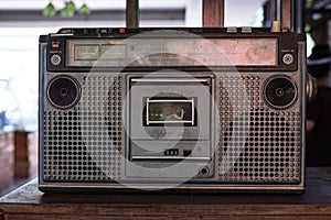 Old fashioned audio tape player on top desk wood