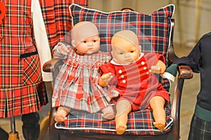 Old Fashioned Baby Dolls in Chair