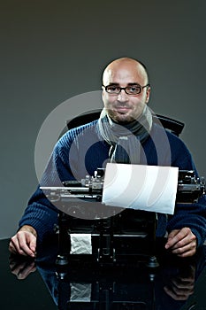 Old fashioned bald writer in glasses