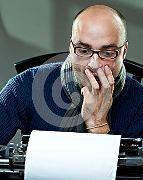 Old fashioned bald writer in glasses