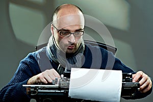 Old fashioned bald writer in glasses