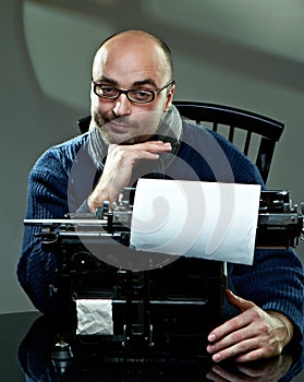 Old fashioned bald writer in glasses