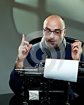 Old fashioned bald writer in glasses