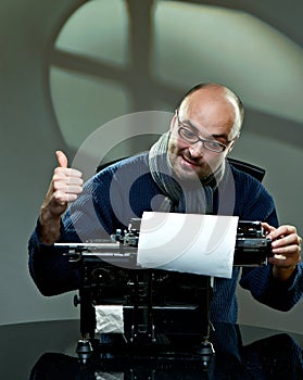 Old fashioned bald writer in glasses