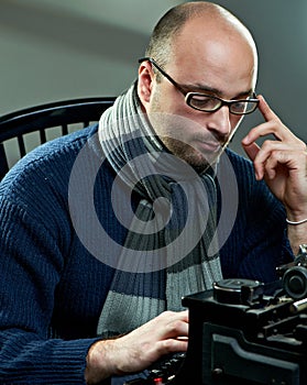 Old fashioned bald writer in glasses