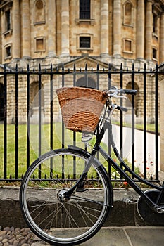 Old Fashioned Bicycle Outside Radcliffe Camera In Oxford By University College Building