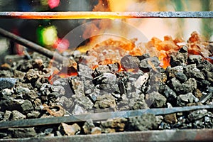 Old fashioned blacksmith furnace with burning coals