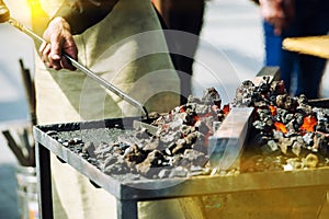 Old fashioned blacksmith furnace with burning coals