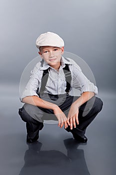 Old fashioned boy sitting