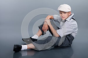 Old fashioned boy sitting