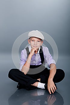 Old fashioned boy sitting