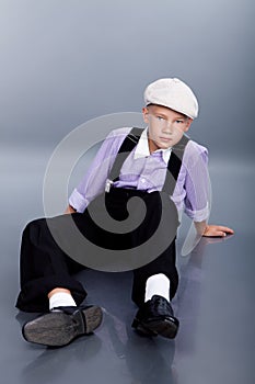 Old fashioned boy sitting