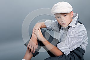 Old fashioned boy sitting