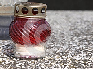 Old fashioned candle on a cemetery