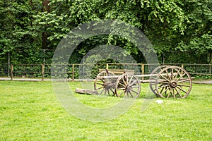 Old fashioned carriage left in an open field
