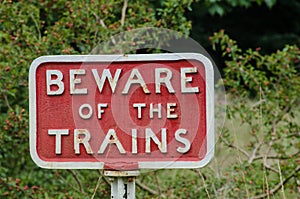 Old fashioned cast iron Beware of Trains sign