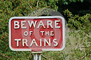 Old fashioned cast iron Beware of Trains sign photo