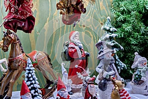 Old fashioned Christmas toys - Santa Claus, horse, dwarfs, and other figurines for sell at the gift store