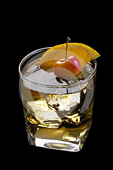Old Fashioned cocktail on a black background
