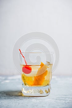 Old fashioned cocktail with cherry