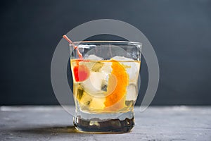 Old fashioned cocktail with cherry