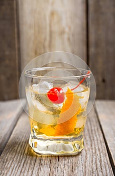 Old fashioned cocktail with cherry