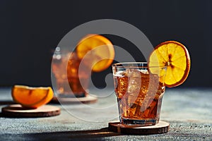 Old fashioned cocktail with hard light and harsh shadows