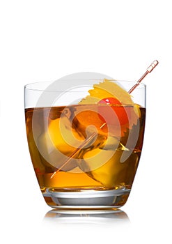 Old fashioned cocktail with ice cubes and cherry with orange peel on white background