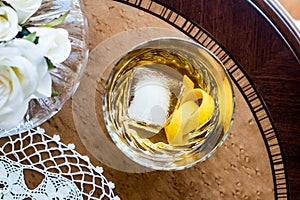 Old Fashioned Cocktail with lemon peel and ice