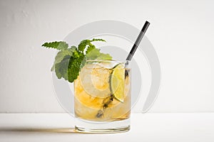 Old fashioned cocktail with lime and mint