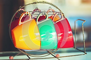 Old-fashioned coffee mugs were hung unused.